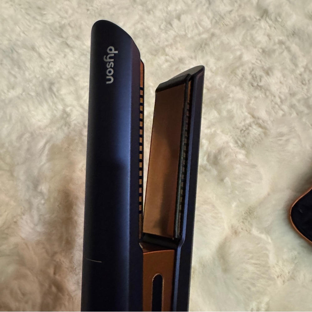Used a handful of times Dyson Hair Straightener in Black/Purple w/Copper plates